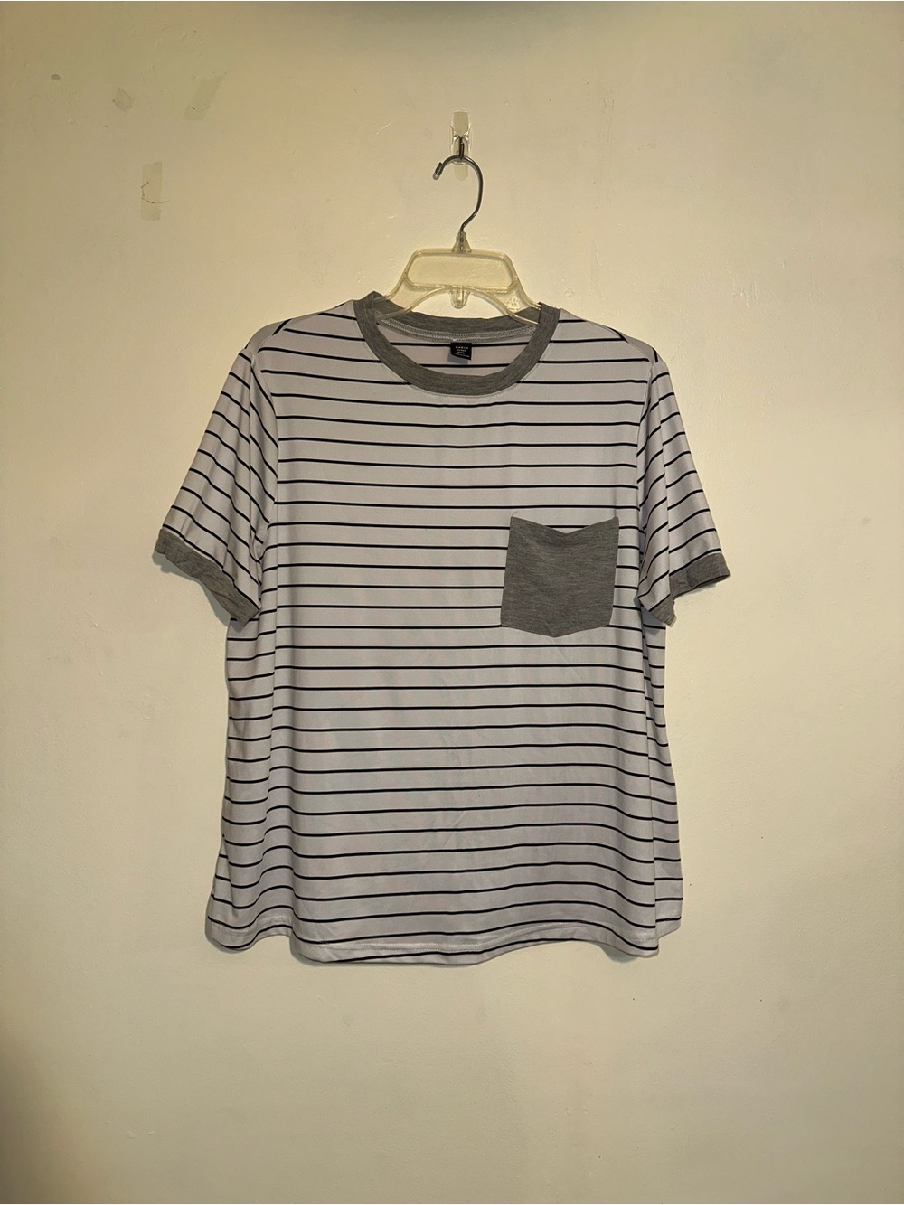 Striped tee with gray pocket and sleeve contrast